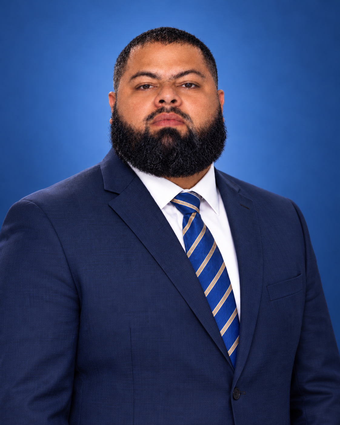 Professional portrait of Derex Marenco in a suit